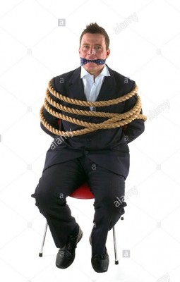 businessman-tied-up-with-rope-and-gagged-with-his-own-tie-isolated-A6A61G crop.jpg